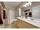 Bathroom featuring a dual sink vanity, tile floor, and a shower/tub combo at 10913 W Chino Dr, Peoria, AZ 85373
