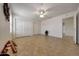 Bedroom with tile floors, neutral walls, ceiling fan and sliding closet doors at 10913 W Chino Dr, Peoria, AZ 85373