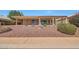 Inviting home exterior with a covered patio, manicured landscaping, and a decorative water fountain at 10913 W Chino Dr, Peoria, AZ 85373