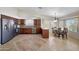 Bright kitchen with stainless appliances, dark wood cabinets, and breakfast nook at 10913 W Chino Dr, Peoria, AZ 85373