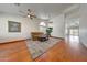 Bright living room with hardwood floors, ceiling fans, and a large window with a view at 10913 W Chino Dr, Peoria, AZ 85373
