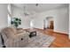 Spacious living room with neutral decor, hardwood floors, and decorative rug at 10913 W Chino Dr, Peoria, AZ 85373