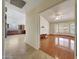Bright living room featuring hardwood floors and large windows, open to the kitchen area at 10913 W Chino Dr, Peoria, AZ 85373