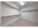 Walk-in closet with built-in shelving and tile flooring at 10913 W Chino Dr, Peoria, AZ 85373