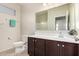 Bright bathroom with vanity, dark cabinets, and a neutral color scheme offering a clean, modern design at 1146 E Viola Ct, Casa Grande, AZ 85122