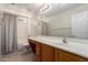 Bathroom featuring vanity with sink, framed mirror and tub-shower combination with neutral finishes at 1182 E Harrison St, Gilbert, AZ 85295