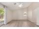 Bright and airy bedroom with ceiling fan, wood-look floors and sliding door to patio at 1182 E Harrison St, Gilbert, AZ 85295