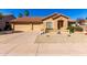 Beautiful single-Gathering home featuring a three-car garage, desert landscaping, and a cozy front porch at 1182 E Harrison St, Gilbert, AZ 85295