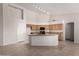 Eat-in kitchen with tile floors, a breakfast bar, granite countertops, and ample cabinet space at 1182 E Harrison St, Gilbert, AZ 85295