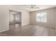 Living room with light-colored floors, neutral walls, bright windows and seamless layout at 1182 E Harrison St, Gilbert, AZ 85295