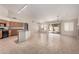 Open living area features tile floors, a sliding glass door to the pool area, and modern lighting at 1182 E Harrison St, Gilbert, AZ 85295