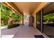 Covered patio with ample sunlight, leading to a landscaped backyard area at 1182 E Harrison St, Gilbert, AZ 85295