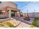 Backyard with covered patio, pavers, string lights and a built-in fire pit at 12056 W Melinda Ln, Sun City, AZ 85373