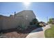 Landscaped backyard featuring desert landscaping and a privacy wall, creating a peaceful outdoor oasis at 12056 W Melinda Ln, Sun City, AZ 85373