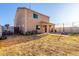 View of a home's backyard featuring an outdoor patio with string lights and block wall at 12056 W Melinda Ln, Sun City, AZ 85373
