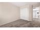 Bedroom featuring carpet flooring and sliding door closet at 12056 W Melinda Ln, Sun City, AZ 85373
