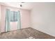 Comfortable bedroom with carpeted flooring and light blue curtains at 12056 W Melinda Ln, Sun City, AZ 85373