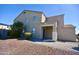Charming two-story home featuring desert landscaping with a covered entry way, enhancing curb appeal at 12056 W Melinda Ln, Sun City, AZ 85373