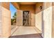 Front entryway with security screen door and textured stucco pillars at 12056 W Melinda Ln, Sun City, AZ 85373