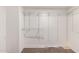 Walk-in closet equipped with wired shelving for maximum storage and organization at 12056 W Melinda Ln, Sun City, AZ 85373
