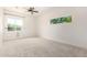 Sunlit bedroom features two windows offering natural light and outdoor views at 1331 E La Mirada Dr, Phoenix, AZ 85042