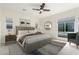 Comfortable bedroom with neutral colors, ceiling fan, and natural light at 1331 E La Mirada Dr, Phoenix, AZ 85042