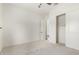 Bright bedroom with carpet flooring shows an open closet with an access door at 1331 E La Mirada Dr, Phoenix, AZ 85042