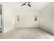 Spacious, bright bedroom has neutral carpet, a ceiling fan, and windows with blinds at 1331 E La Mirada Dr, Phoenix, AZ 85042