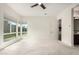 Bedroom with neutral carpet, large windows providing lots of light, and access to a private backyard at 1331 E La Mirada Dr, Phoenix, AZ 85042