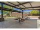 Community picnic area with covered tables, volleyball court and beautiful desert landscaping at 1331 E La Mirada Dr, Phoenix, AZ 85042