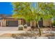 Charming single-story home features modern design, low maintenance landscaping and large garage door at 1331 E La Mirada Dr, Phoenix, AZ 85042