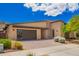 Modern single-story home with desert landscaping, and brick driveway and pathway at 1331 E La Mirada Dr, Phoenix, AZ 85042
