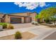 Modern single-story home with desert landscaping, and brick driveway and pathway at 1331 E La Mirada Dr, Phoenix, AZ 85042