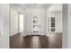 Modern foyer featuring elegant dark wood flooring and light-filled entryway at 1331 E La Mirada Dr, Phoenix, AZ 85042