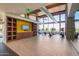Spacious gym featuring modern equipment, wood-look floors and beautiful wall and ceiling details at 1331 E La Mirada Dr, Phoenix, AZ 85042