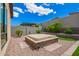 Backyard hot tub with stone surround and landscaping at 1331 E La Mirada Dr, Phoenix, AZ 85042