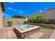 Backyard hot tub with landscaped surroundings and privacy wall at 1331 E La Mirada Dr, Phoenix, AZ 85042