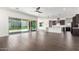 Open-concept living room featuring an island kitchen, large sliding glass doors and tile flooring at 1331 E La Mirada Dr, Phoenix, AZ 85042