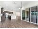 Bright living room with dark wood floors and sliding glass doors open to the outside at 1331 E La Mirada Dr, Phoenix, AZ 85042