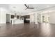 Open-concept living room featuring a modern kitchen, and elegant tile flooring at 1331 E La Mirada Dr, Phoenix, AZ 85042