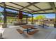 Community outdoor pavilion featuring a metal frame, picnic tables, and inviting landscaping at 1331 E La Mirada Dr, Phoenix, AZ 85042