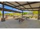 Shaded outdoor pavilion features picnic tables, landscaping and native rock formations at 1331 E La Mirada Dr, Phoenix, AZ 85042