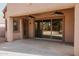 Covered patio with ceiling fans, sliding glass door access and an open area for entertaining at 13542 W Port Au Prince Ln, Surprise, AZ 85379