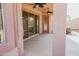 Relaxing covered back patio featuring ceiling fans, sliding glass door and textured posts at 13542 W Port Au Prince Ln, Surprise, AZ 85379
