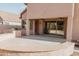 Enjoy this outdoor living space with a large patio, built-in grill, and ceiling fans at 13542 W Port Au Prince Ln, Surprise, AZ 85379