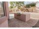 The backyard features a built-in grill and a low maintenance yard at 13542 W Port Au Prince Ln, Surprise, AZ 85379