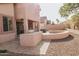 The backyard features an outdoor grill, a spa and a low maintenance yard at 13542 W Port Au Prince Ln, Surprise, AZ 85379