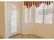 Sunlit breakfast nook with large windows and access to the exterior patio or yard at 13542 W Port Au Prince Ln, Surprise, AZ 85379