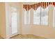 Bright breakfast nook with tile flooring, big windows and natural light at 13542 W Port Au Prince Ln, Surprise, AZ 85379