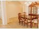Elegant dining room featuring a classic china cabinet and ample space for entertaining at 13542 W Port Au Prince Ln, Surprise, AZ 85379